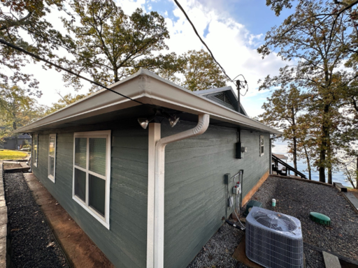 By efficiently diverting rainwater, reducing roof
